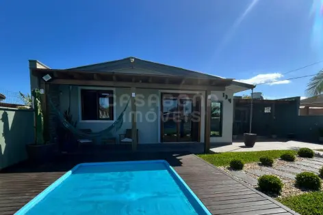 Imagem principal do Casa de Veraneio a 130 metros do Mar no Balneário São Jorge