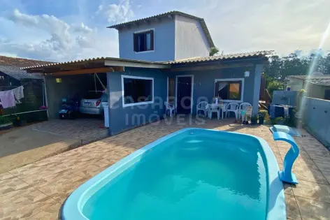 Imagem principal do Casa com piscina e 4 dormitórios a apenas 600 metros da praia em Rondinha